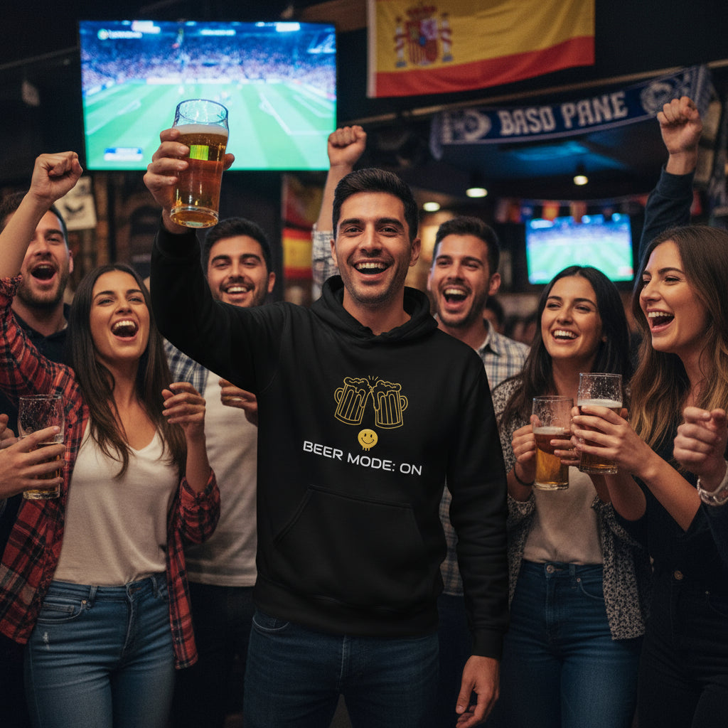 Beer Mode On premium black hoodie lifestyle photo Madrid sports pub Spain Champions League football match - Spanish man late 20s black hair celebration pint glass friends UEFA soccer culture - bold white text graphic beer enthusiast pub culture Spanish nightlife football fan apparel unisex hoodie Guapo Originals Premium Designer Collection €39.99 Spain