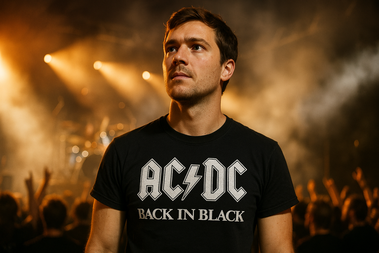 White guy wearing AC/DC Back in Black shirt at concert